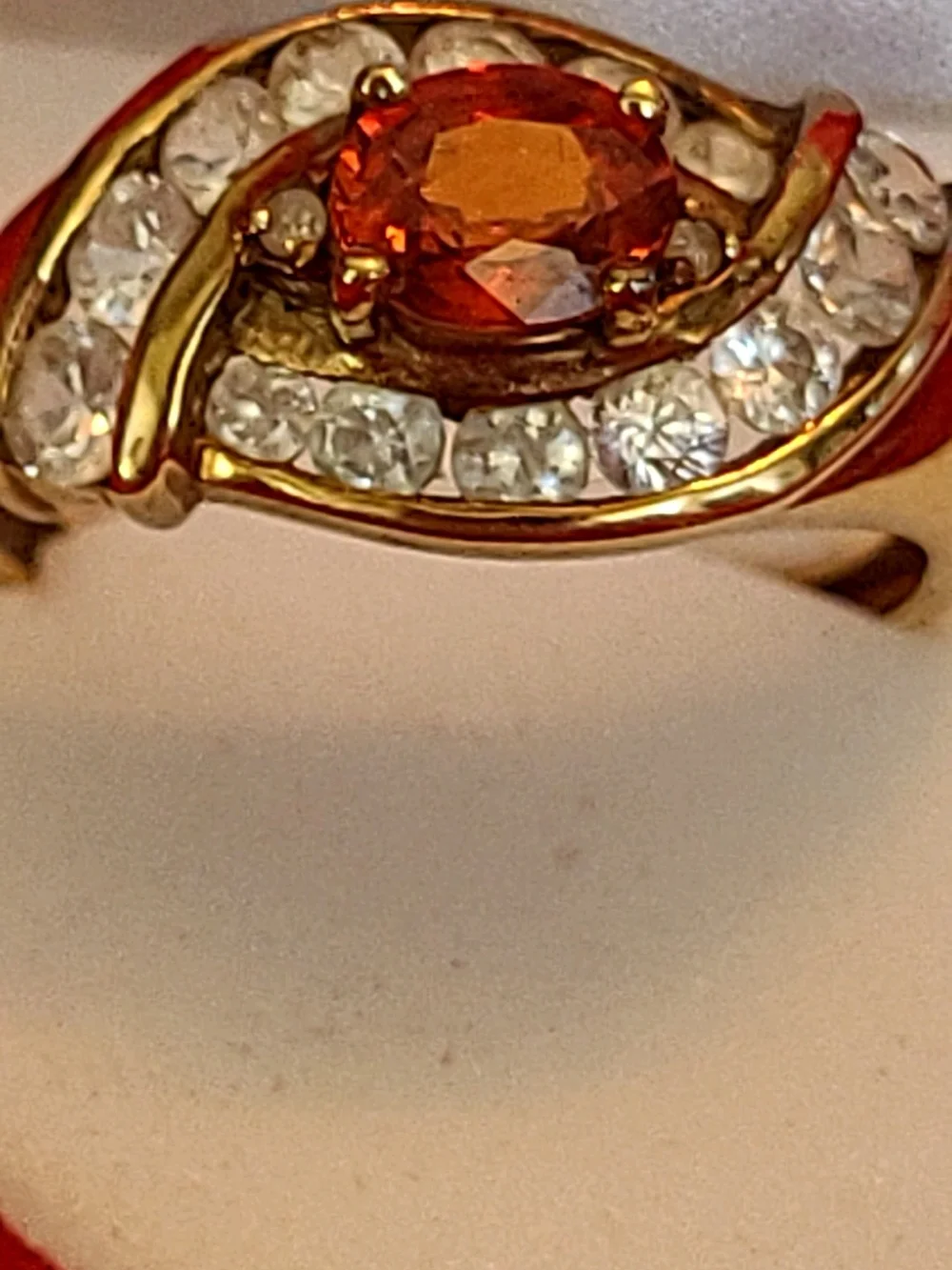 1.25ct. Spessartite Garnet Surrounded By 14 Sparkling Diamonds!